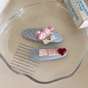 Korean sweet fabric duckbill hair clips with cute bunny and heart design for women.