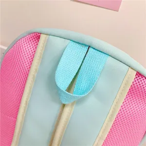 Close-up detail of cute Japanese style ita backpack featuring pink mesh and blue straps.