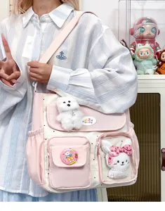 Vintage colorblock large capacity canvas shoulder bag with cute plush toy pendants for women.