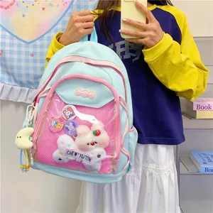 Cute Japanese ins ita backpack with transparent pocket for anime pins and plush toys.