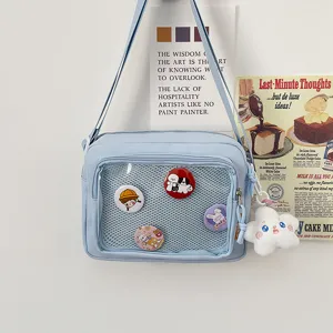 Japanese style canvas ita bag clear window shoulder crossbody bag with pins and plush charm.
