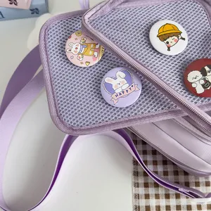 Japanese ins style light purple ita shoulder bag with cute mesh pocket and decorative badges.