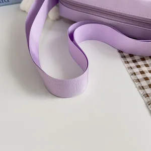Close-up detail of light purple shoulder bag strap, aesthetic student crossbody bag part