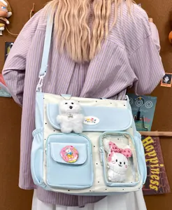 Vintage colorblock canvas shoulder bag for women, cute ita bag with plush toy and transparent pocket.