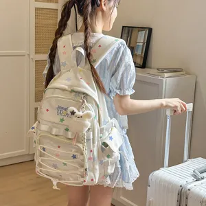 Joli sac à dos motif étoiles avec poche avant transparente pour école et quotidien.