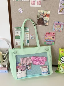 Mint green ita bag detail view, showing clear mesh front pocket for pins and custom accessories.
