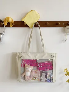 Cute white ita bag large capacity transparent window tote bag with anime merch display.
