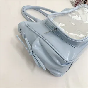 Gran bolso ita azul claro con bolsillo transparente y asas dobles para uso diario.