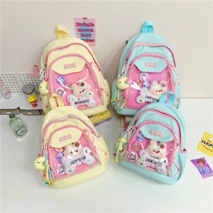 Cute Japanese ita backpack for women, clear pocket school bag with plush bunny and pins.
