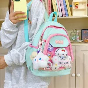Kawaii Japanese style ins cute backpack for women, pastel blue pink ita bag with plush charms.