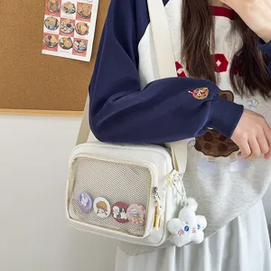 Japanese ins style white ita bag crossbody canvas shoulder bag with clear mesh pocket for pins.