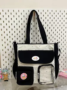 Retro color block large capacity canvas tote bag with multi pockets and cute design.