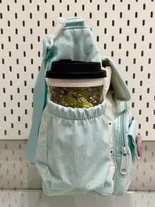 Mint green casual crossbody bag with front pocket and shoulder strap for daily commuting school.