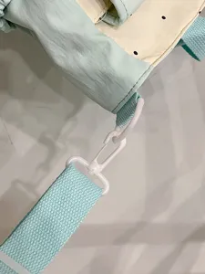 Canvas tote bag strap detail, retro color block design, durable hardware fitting.
