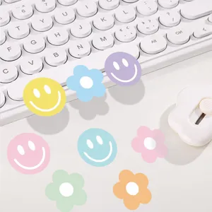Colorful smiley face and flower stickers for kids, decorative self-adhesive labels roll.