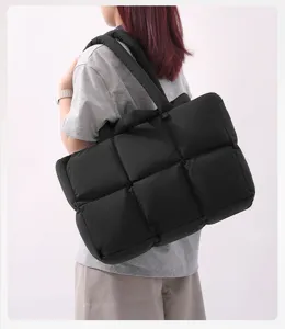 Black quilted padded shoulder bag, soft puffer tote bag with thick strap for women daily commuting.