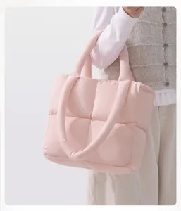 Pink quilted tote bag, soft puffer shoulder bag for women, stylish casual daily handbag.