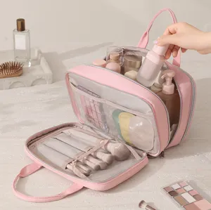 Large capacity multi-layer pink travel cosmetic bag with brush slots and pockets.