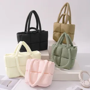 Stylish puffer tote bag with quilted design, soft padded shoulder bag and fashion handbag.