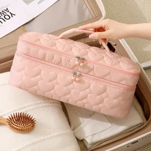 Borsa da viaggio trapuntata rosa a doppio scomparto per asciugacapelli e accessori styling