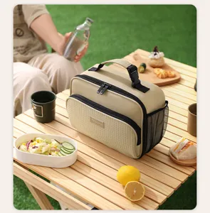 Portable insulated lunch cooler bag for office work, school, and outdoor camping picnic use.