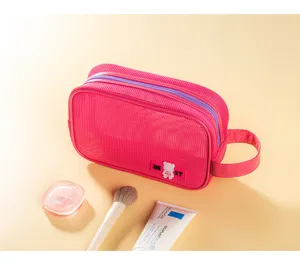 Pink mesh cosmetic bag with double zipper and handle, portable travel toiletry storage pouch.