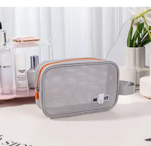 Grey mesh toiletry bag, portable travel cosmetic organizer with orange zipper for beach outdoor.