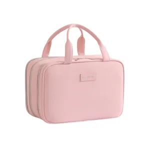 Pink multi-layer travel cosmetic bag with handle, large capacity storage case for toiletries.