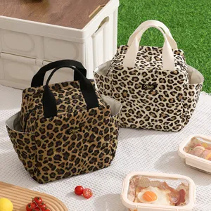 Quilted leopard print insulated lunch bag with handles and side pockets for outdoor daily use.