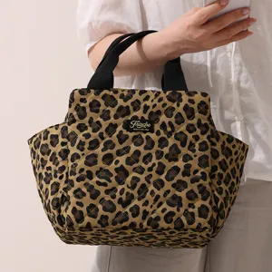 Quilted leopard print lunch bag tote handbag with handles and side pockets for work picnic.