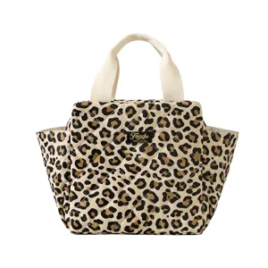 Quilted leopard print lunch bag with sturdy handles and side pockets for daily office use.