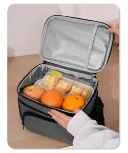 Grey insulated lunch bag detail view showing spacious interior compartment and mesh pocket.