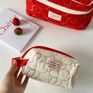 Large capacity quilted cosmetic bag with cute rabbit embroidery, portable travel toiletry pouch.