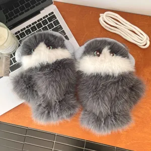 Close-up details of cute ragdoll cat plush gloves, thick warm winter fluffy hand warmers.