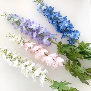 Close up detail of long stem artificial delphinium flowers, colorful decor for home and events.