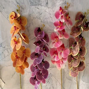 Artificial 9-head Phalaenopsis orchid flowers, European style, perfect for home and wedding decor.