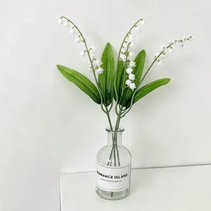 Artificial lily of the valley flower detail view, fresh European style bouquet for home decoration.