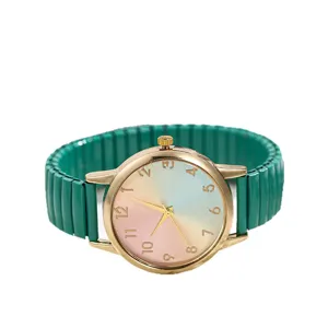 Women quartz watch with green stretch band, colorful rainbow dial and gold case for daily wear.