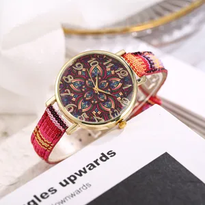 Bohemian women quartz watch with colorful fabric strap and vintage mandala pattern dial.