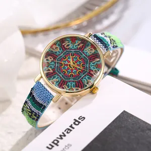 Bohemian ethnic style women quartz watch with colorful canvas strap and retro dial detail.