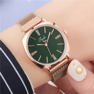 Green dial rose gold quartz watch close up detailed view mesh strap elegant design