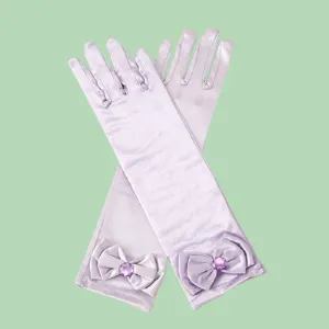 Exquisite long satin gloves for kids featuring elegant bows and sparkly purple gems detail.