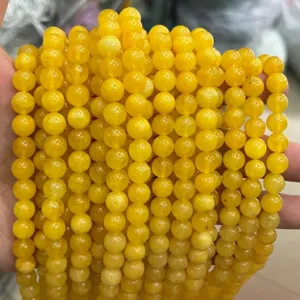 Grossiste perles rondes en pierres gemmes jaunes pour bracelets et accessoires de bijoux.