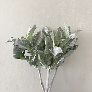 Detail shot of artificial dusty miller leaves, showing soft flocked texture and natural green color.