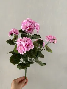 Artificial silk geranium flower bouquet detail view for home wedding decor and photography.