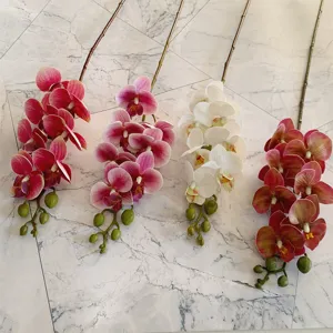 Details of artificial 3D phalaenopsis orchid stems in multiple vibrant colors for decor.
