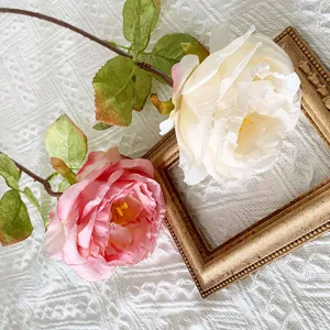French retro artificial rose silk flower detail showing burnt edges and realistic texture.