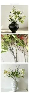 Kunstblumenstrauss Detailansicht, Zweigstruktur und dekoratives Vasen Setup Design.