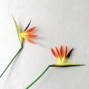 Close-up detail of artificial bird of paradise flower, realistic silk floral decor.
