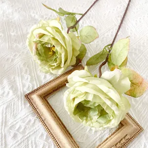 Close-up detail of vintage artificial rose flower with burnt edge design for home decor.